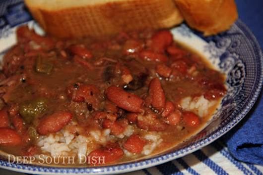 Slow Cooker red beans & rice made with dried beans, and cooked with a ham bone, bacon and smoked sausage.