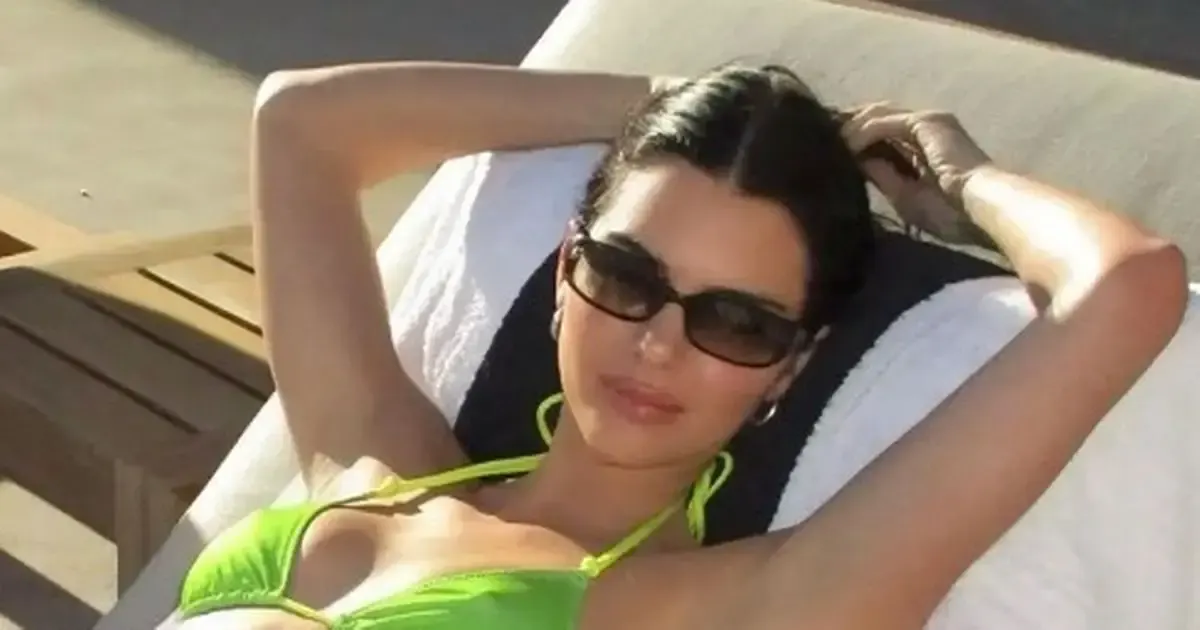 Kendall Jenner soaking wet and topless as she showcased her tan while posing dripping in water