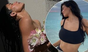 Kylie Jenner shocks the internet by posting a series of images of herself in which she poses nude in the shower, with only a bouquet of flowers for cover