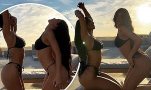 Bikini battle! Kim Kardashian and her "twin" Kylie Jenner wow in black swimsuits near the pool