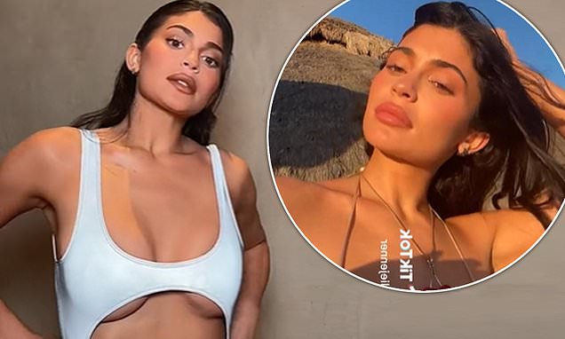 Kylie Jenner visits the beach in a ruched nude bikini, then changes into a bustier white cut-out swimsuit to show off her stunning figure