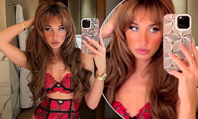 Megan McKenna is stunning in red and black lace underwear that accentuates her toned body