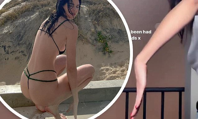 Kendall Jenner shows off her "long a** hands and fingers" in reaction to admirers who claimed her latest swimsuit photo was a Photoshop disaster