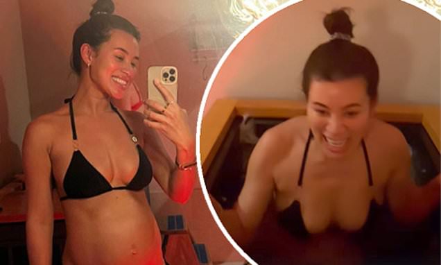Pregnant Montana Brown, of Love Island fame, shows off her baby bulge in a skimpy black bikini by taking a dip in an icy pool