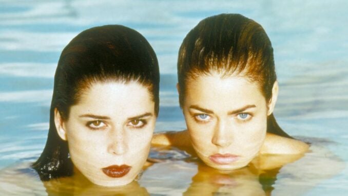 Denise Richards revealed that she was "terrified" while filming a steamy lesbian kiss for the Wild Things pool scene