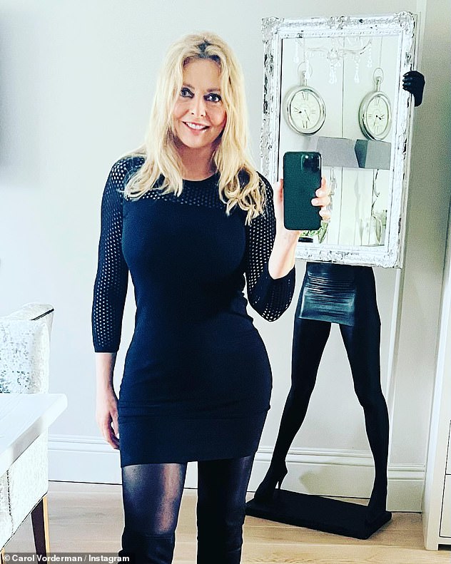 Carol Vorderman flaunts her fantastic physique before speaking on BBC Radio Wales in a form-fitting black dress and knee-high boots