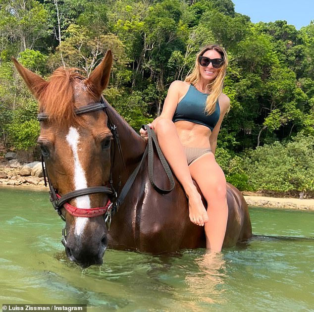 Luisa Zissman Flaunts Her Abs In A Blue Bikini While Riding A