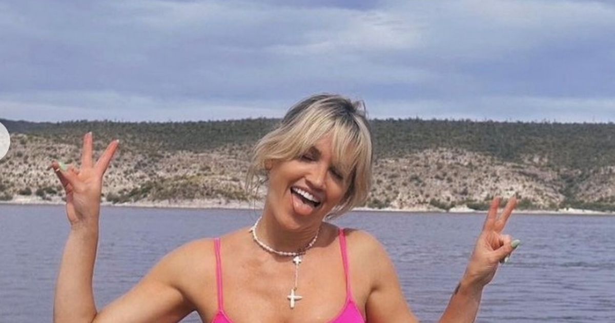 Ashley Roberts, 41, is called "beautiful in pink" as she bares all in her skimpiest pink bikini