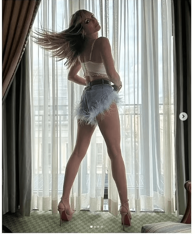 As Heidi Klum shows support for her husband Tom Kaulitz in fuzzy denim shorts, she turns into an adoring fan