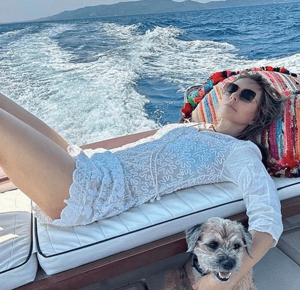 As Liz Hurley flashes her legs in a tiny bikini, she shows off her see-through cover-up