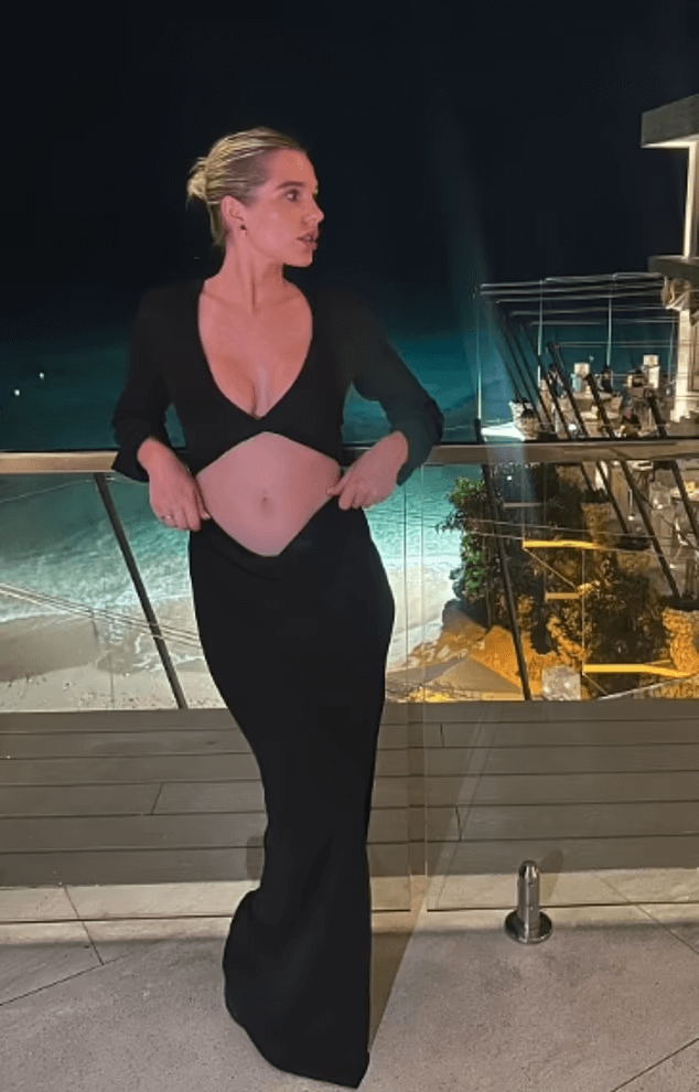 Helen Flanagan reveals her toned abs in a black cut-out gown during a sun-soaked Barbados vacation
