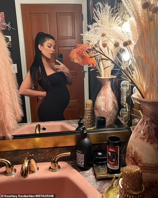 In a new photo dump, Kourtney Kardashian reveals a growing baby bump