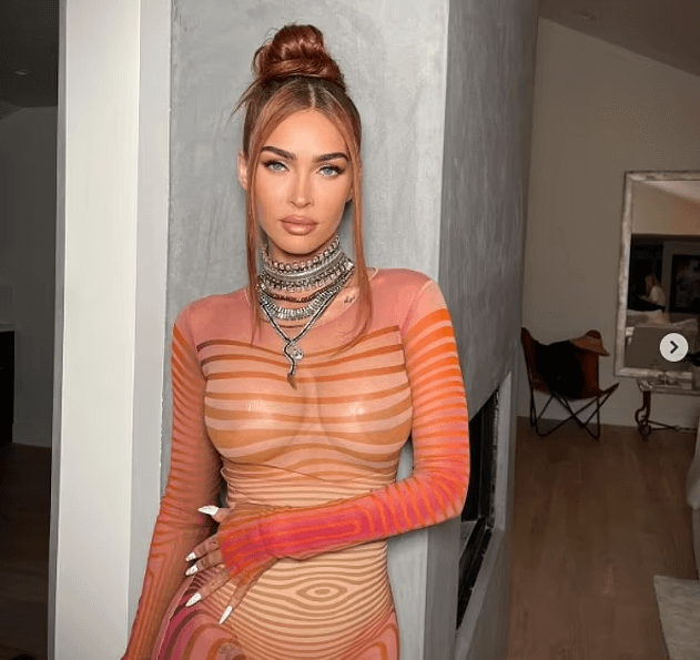 Megan Fox stepped out in a bodycon orange dress for sultry snaps shared by her makeup artist on Tuesday. The 37-year-old actress flaunted her ample assets in the bodycon dress.