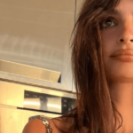 A recent vacation selfie showed off Emily Ratajkowski’s toned body in a barely-there orange bikini