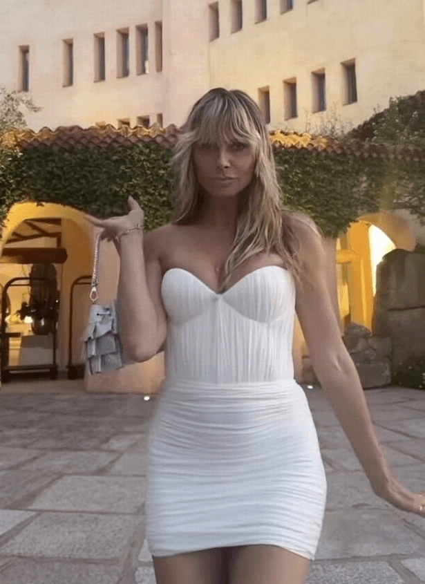 While on holiday in Sardinia, Heidi Klum stunned fans in a strapless mini dress