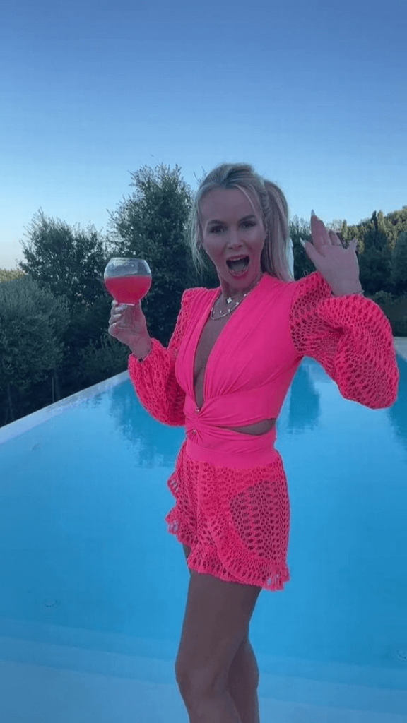 In a playful TikTok video, Amanda Holden showed fans that she was the perfect Barbie in a neon pink dress.