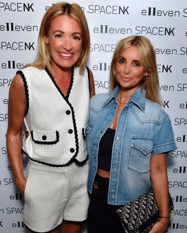 Another photo showed her wearing black trousers and accessorizing with a matching clutch bag.
