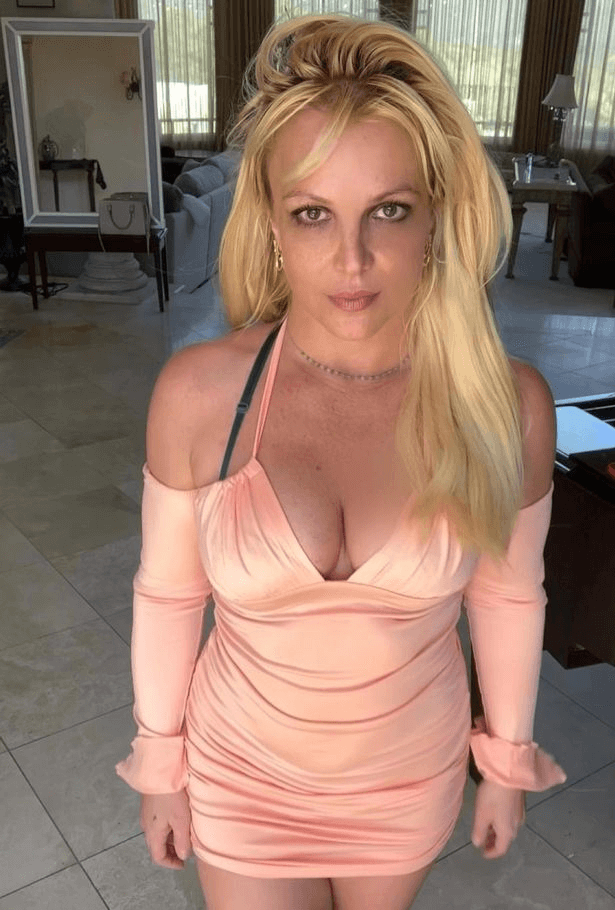 In a plunging dress, Britney Spears showcases her iconic curves