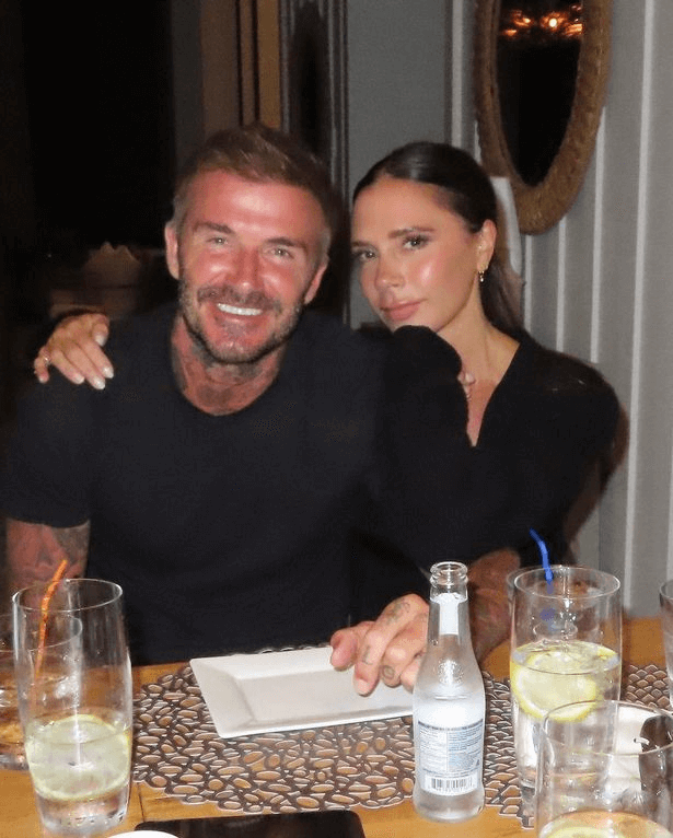 In a tiny dress, Victoria Beckham exposes all while cuddling David Beckham