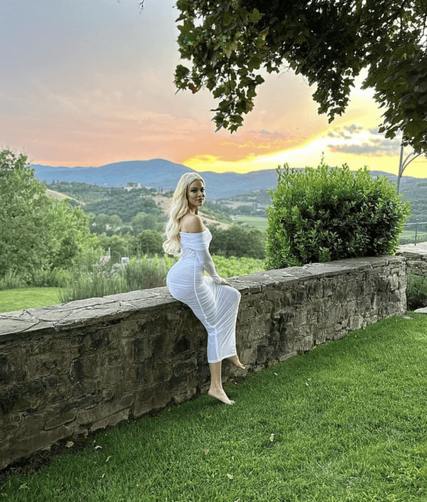 One photo shows Khloe seated on a short wall as the sunset turned the sky brilliant shades of yellow and orange.