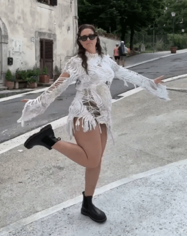 In an Instagram photo taken behind the scenes of a Vogue shoot, Ashley Graham showed off her curves in a see-through mini dress that accentuated her figure.
