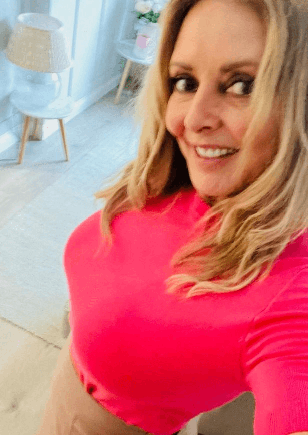 With fishnet tights and leather skirt, Carol Vorderman is dubbed 'the hottest woman alive'
