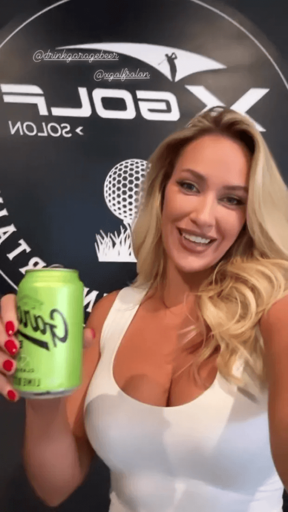 At the event, Paige Spiranac wore a low-cut white tank top and black leggings while posing for photos.