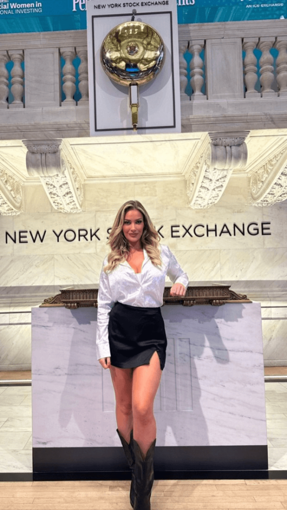 In a revealing "party in the back" outfit, Paige Spiranca posed outside one of the world's largest financial institutions.
