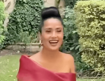 At a lavish gala, Salma Hayek shows off her figure in a skintight red dress