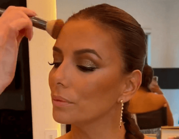 At her estate, Eva Longoria rocks a cleavage-bareing dress whilst getting glammed up