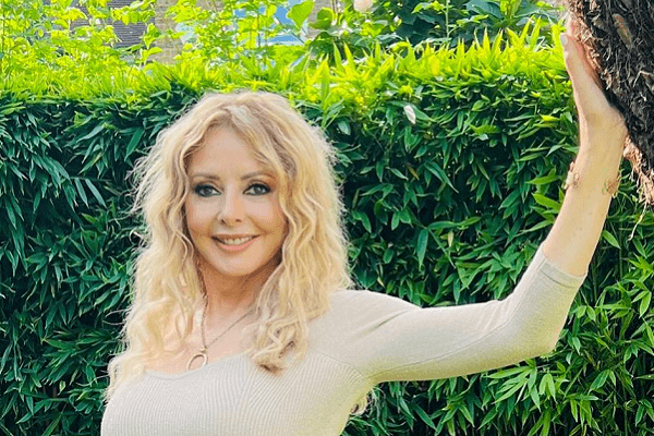 Fans say Carol Vorderman looked like 20 in a figure-hugging dress while displayed her gym-honed figure in a lush garden Fans say Carol Vorderman looked like 20 in a figure-hugging dress while displayed her gym-honed figure in a lush garden