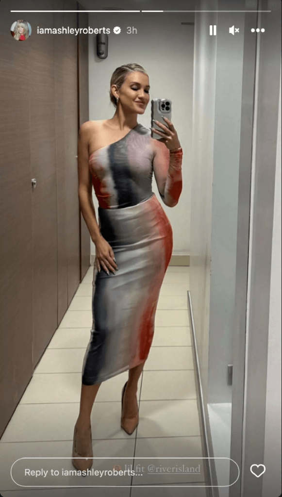 In September , Ashley showed off her figure in a red, gray and white dress that featured one sleeve that went over her right arm.