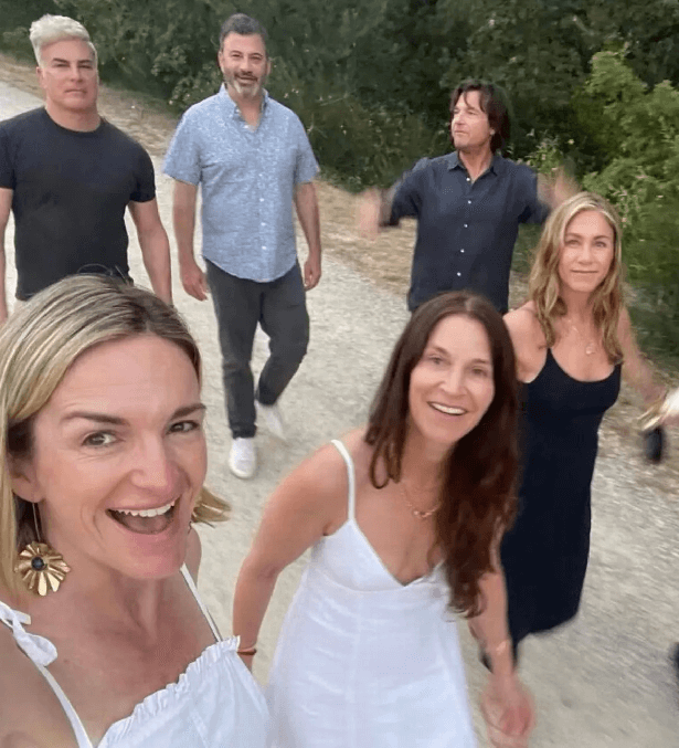 Another post showed Jen wearing a strappy black dress while walking alongside stars such as Jimmy Kimmel and Jason Bateman's wife Amanda Anka.
