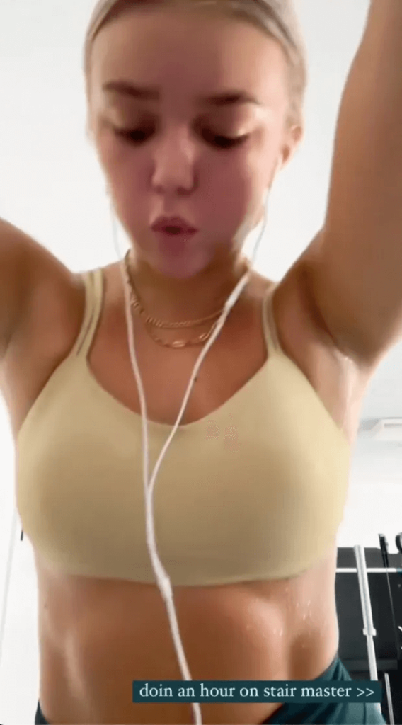 In a brutal new workout video, Paige Spiranac rival Katie Sigmond sports sweat stains after an hour spent on a Stair Master.