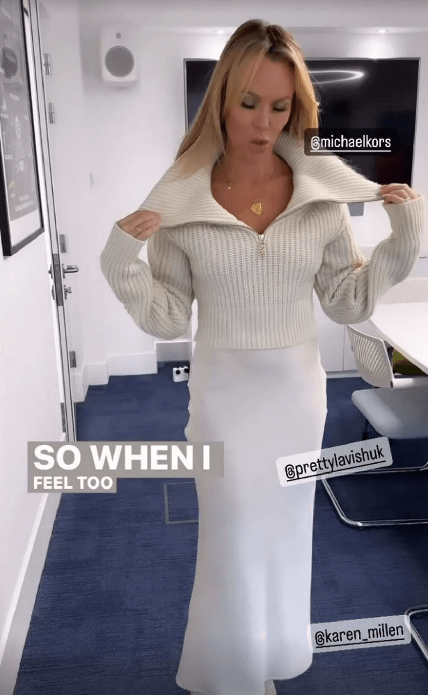 Amanda Holden shows off her curves in a white satin skirt and ditches coat