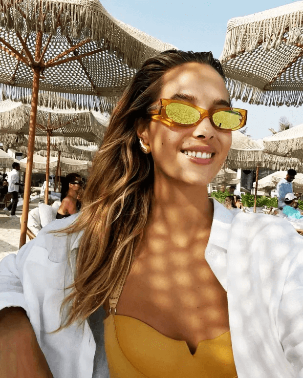 At the end of October, Victoria Varga shared photos of herself relaxing on the beach in Dubai in a full-body yellow bikini.