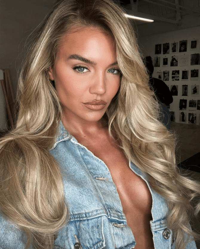 Molly, 30, left little to the imagination in a snap shared on Instagram on Tuesday, wearing a plunging denim jacket that flashed her cleavage.