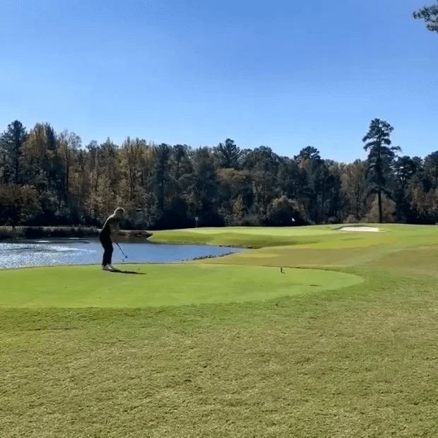 As she demonstrated her technique for fixing the mark without killing the grass, she pulled a tee from her top.