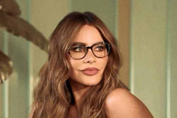 Sofia Vergara flaunts her killer curves in a skintight leather dress paired with sultry glasses