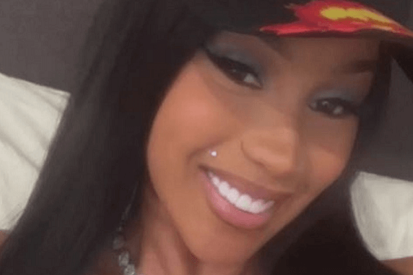 Taking an eye-popping bedroom selfie, Cardi B barely avoids an awkward nip slip