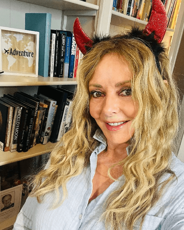 In an unbuttoned shirt and with devil horns, Carol Vorderman had fans heaping compliments on her.