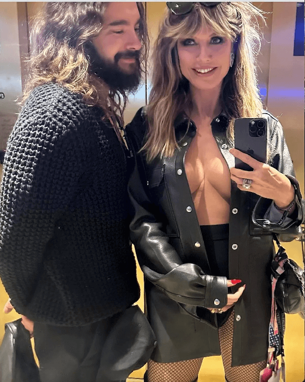 With her husband Tom Kaulitz by her side, she rocked up arm-in-arm, wearing just an oversized leather jacket to cover her modesty and killer thigh-grazing boots and fishnet tights.