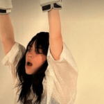 As Billie Eilish sweated out in tight gym shorts, she flaunted her famous curves