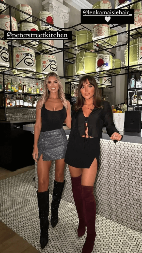 Christine McGuinness stuns in a plunging black top and tiny skirt on a night out