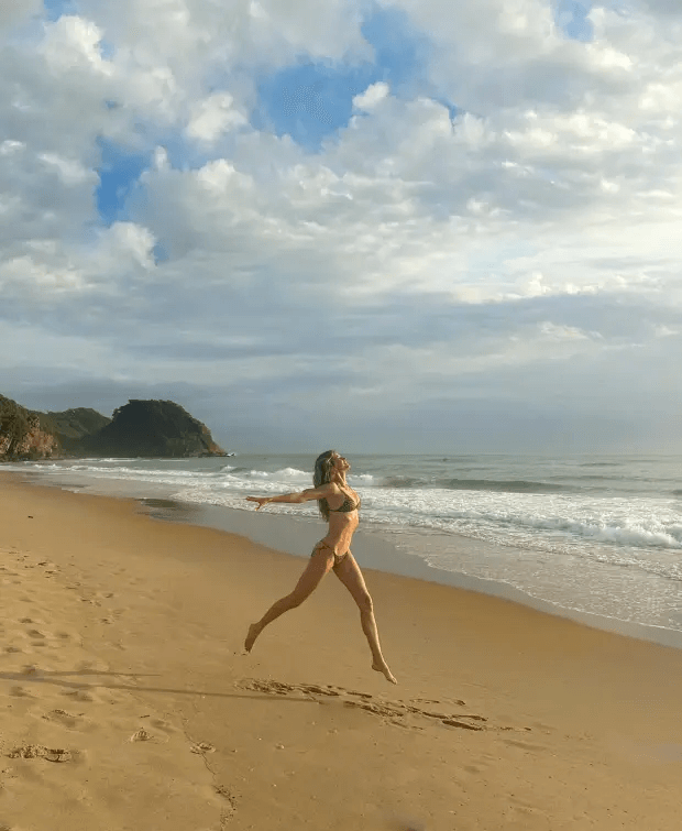 Gisele Bundchen posted a photo of herself prancing on a Brazilian beach wearing a brown two-piece bikini.