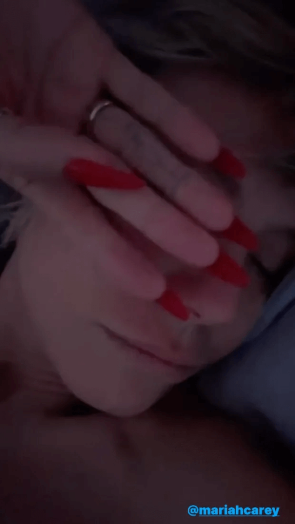 As Heidi Klum appeared topless while lying in bed, she called out for her best friend Mariah Carey.