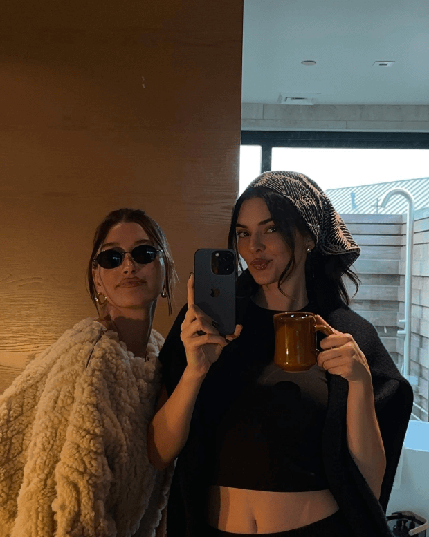 Taking a selfie with Hailey while holding a mug of tea, Kendall showed off her glamorous side and wore an all-black outfit for a horseback ride.