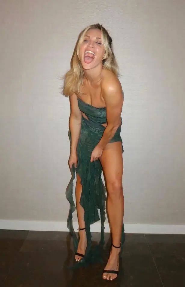 A series of stunning shots of Ashley Roberts wearing a slinky green dress with cut-out sections have recently gone viral on social media.