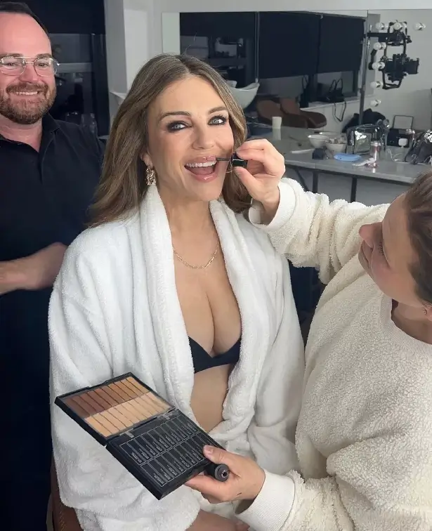 Fans go wild as Elizabeth Hurley poses in an open white robe with a plunging bra in sizzling pictures