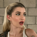 In a teeny white crop top, Sami Sheen shows off new boobs and bares her flat stomach